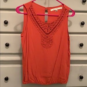 Sleeveless orange blouse
